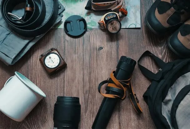 Camping gear on wooden table