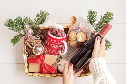 Christmas gifts for employees: a basket filled with assorted wines