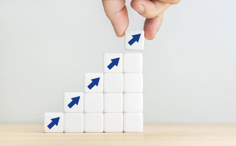 rising blue arrow representing gift card incentives trends