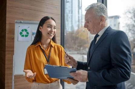 Young female assistant smiling to her boss